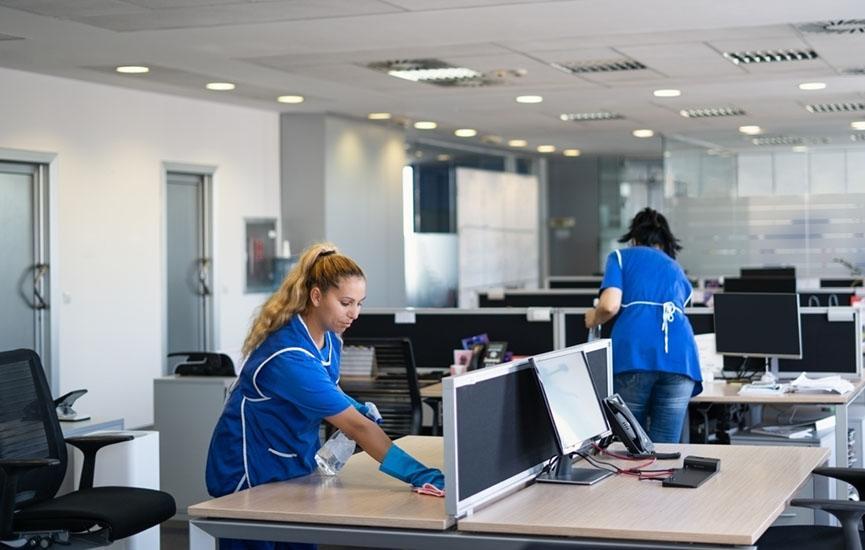 Cleaners clean empty office spaces